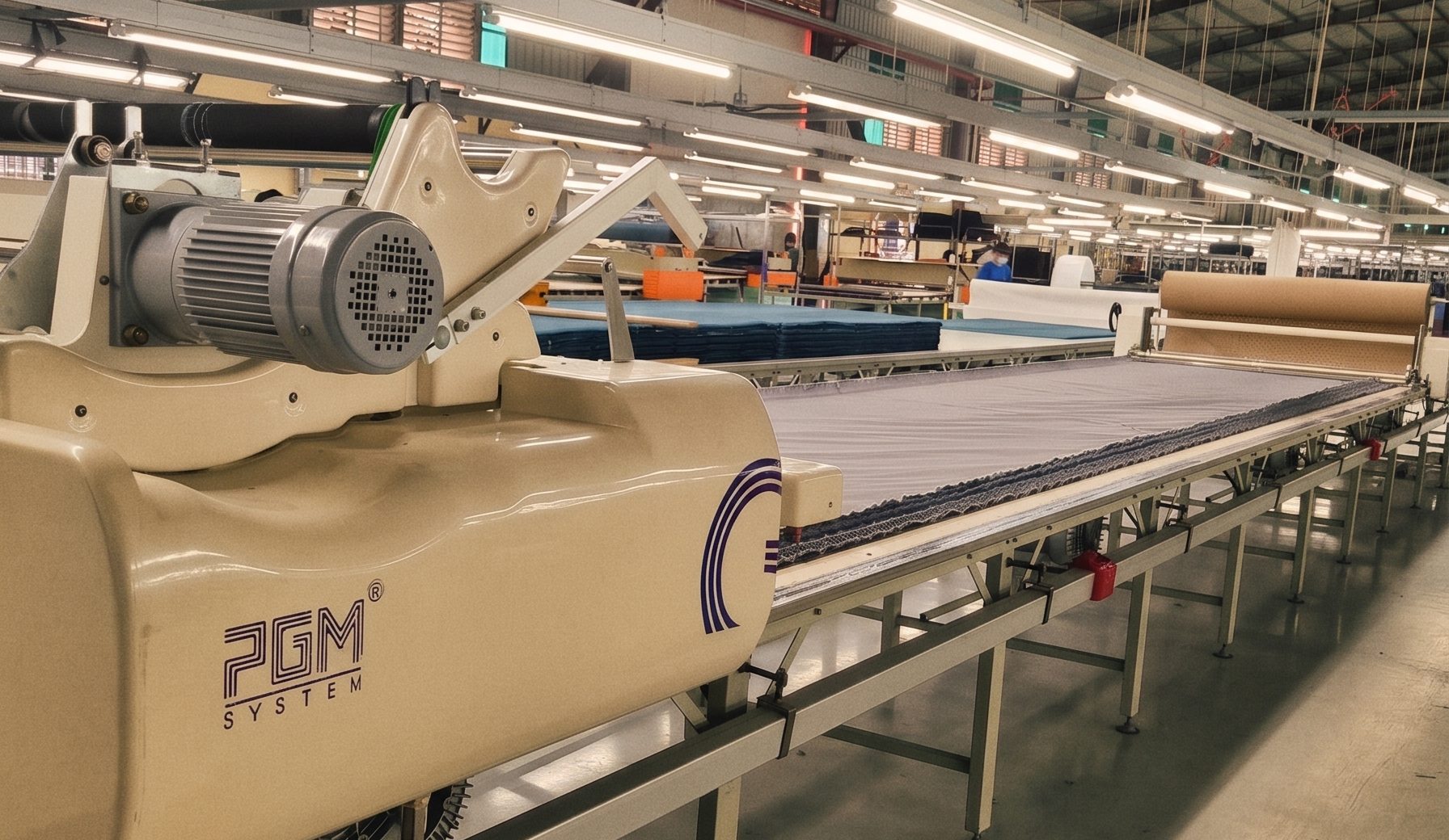 PGM automated fabric-cutting machine on the kinship mfg factory floor